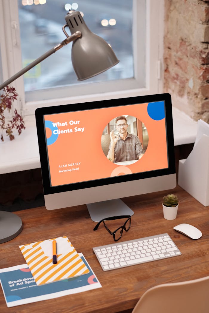 vision Stylish home office setup with computer showcasing client testimonials.
