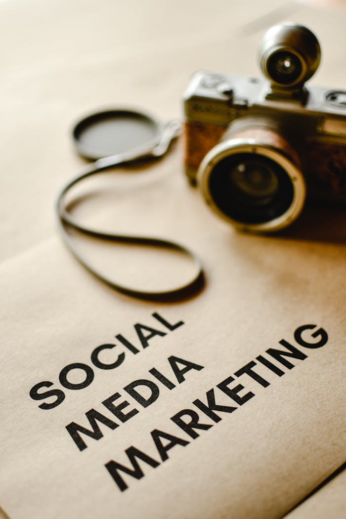 gallery-03 Close-up of a vintage camera on brown paper labeled with 'Social Media Marketing'.